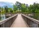 Wooden fishing pier over calm lake with seating at 1012 Sweetleaf Dr, Fort Mill, SC 29707