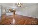 Spacious living room with hardwood floors and a view of the kitchen at 1012 Sweetleaf Dr, Fort Mill, SC 29707