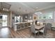 Modern kitchen with island, ample seating, and sleek gray cabinetry at 2006 Gibbs Farm Dr, Monroe, NC 28110