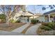 Tan exterior house with green door and walkway at 2712 New Hamlin Way, Charlotte, NC 28210