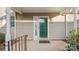 Green front door with glass panels and black metal railing at 2712 New Hamlin Way, Charlotte, NC 28210