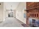 Living room with brick fireplace and vaulted ceiling at 2712 New Hamlin Way, Charlotte, NC 28210