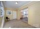 Sunroom with sliding glass doors and brick feature wall at 2809 Markland Dr, Charlotte, NC 28208