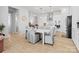 Kitchen breakfast nook with white table and gray leaf patterned chairs at 401 Portrait Way, Indian Trail, NC 28079