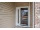 Front door with glass sidelights and storm door at 4034 Broadview Ln, Gastonia, NC 28056