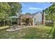 Spacious backyard with patio, pergola, and lush greenery at 4131 Huntmeadow Dr, Charlotte, NC 28269