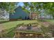 Backyard with fire pit and wooden bench at 4131 Huntmeadow Dr, Charlotte, NC 28269