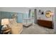 Bright Bedroom with crib, armchair, and dresser at 4131 Huntmeadow Dr, Charlotte, NC 28269