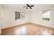 Bright bedroom with hardwood floors and two windows at 521 Colony Acres Dr, Charlotte, NC 28217