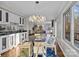 Bright dining area with glass table and chandelier at 9334 Hunting Ct, Matthews, NC 28105