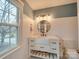 Stylish bathroom with a farmhouse sink and large mirror at 10312 Woodview Cir, Charlotte, NC 28277