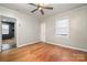 Bedroom with hardwood floors, ceiling fan, and closet at 1055 Laurel Ave, Lancaster, SC 29720