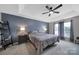 Spacious bedroom with ceiling fan, large windows, and ample space at 1437 Autumn Ridge Ln, Fort Mill, SC 29708