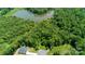 Aerial view of a wooded lot near a lake at 168 Wylie Trl, Statesville, NC 28677