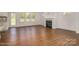 Living room with hardwood floors, fireplace, and access to backyard at 168 Wylie Trl, Statesville, NC 28677