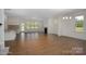Open living room features hardwood floors, fireplace, and kitchen views at 168 Wylie Trl, Statesville, NC 28677