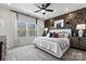 Spacious bedroom with large windows, neutral decor, and ceiling fan at 1736 Blanche St, Charlotte, NC 28262