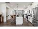 Spacious kitchen with an island, white cabinetry, and stainless steel appliances at 1736 Blanche St, Charlotte, NC 28262