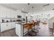 Modern kitchen with white cabinets, stainless steel appliances, and an island at 1736 Blanche St, Charlotte, NC 28262