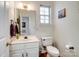 Clean and updated half bathroom with a pedestal sink and toilet at 17628 Cambridge Grove Dr, Huntersville, NC 28078