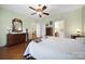 Main bedroom with hardwood floors, ceiling fan, and access to bathroom at 2006 Wheatfield Ct, Fort Mill, SC 29707