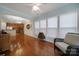 Bright sunroom with hardwood floors, wicker furniture, and views of backyard at 2011 Vermount Way, Fort Mill, SC 29707