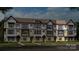 Modern three-story townhome community with landscaped yards at 207 Tamala St, Davidson, NC 28036