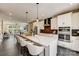 Modern kitchen with stainless steel appliances and breakfast bar at 207 Tamala St, Davidson, NC 28036