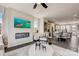 Open living room with fireplace, kitchen views, and large TV at 207 Tamala St, Davidson, NC 28036