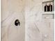 Modern shower with marble tile and built-in shelves at 207 Tamala St, Davidson, NC 28036