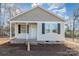 Newly constructed home with gray siding, front porch, and brick base at 25 Kesler St, Salisbury, NC 28144