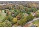 Aerial view of a property nestled among trees, showcasing its surroundings at 3417 Beaty Rd, Gastonia, NC 28056