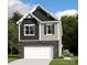 Two-story house with gray and beige siding, stone accents, and a two-car garage at 4027 Lawnview Dr, Charlotte, NC 28269