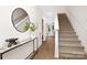 Bright entryway with a staircase, mirror, and console table at 4936 Jane Ave, Charlotte, NC 28269