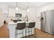 Modern kitchen with white cabinets, stainless steel appliances, and an island at 4936 Jane Ave, Charlotte, NC 28269