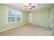 Well-lit bedroom, featuring ceiling fan and light green walls at 501 Riviera Pl, Rock Hill, SC 29730