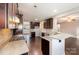 Kitchen with dark brown cabinets, granite countertops, and stainless steel appliances at 501 Riviera Pl, Rock Hill, SC 29730