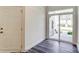 Bright laundry room with sliding glass door leading to backyard at 5544 Stafford Rd # 30, Charlotte, NC 28215