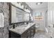 Updated bathroom with double vanity and patterned wall at 6108 Netherwood Dr, Charlotte, NC 28210