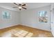 Simple bedroom with hardwood floors and large windows at 6108 Netherwood Dr, Charlotte, NC 28210