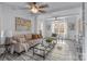 Relaxing living room with a beige sofa and large windows at 6108 Netherwood Dr, Charlotte, NC 28210