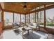 Relaxing screened porch with wooden ceiling and comfortable seating at 6108 Netherwood Dr, Charlotte, NC 28210