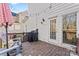 Deck with grill, seating, and string lights; overlooks backyard at 6701 Choppy Wood Cir, Charlotte, NC 28226