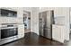 Modern kitchen features stainless steel appliances and white cabinetry at 6701 Choppy Wood Cir, Charlotte, NC 28226