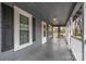 Front porch with white railing and gray flooring at 823 Frederick St, Shelby, NC 28150