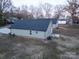 Aerial view of the back of a house with a grassy yard at 1014 Kansas St, Kannapolis, NC 28083
