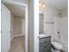 Bathroom with granite countertop, shower/tub combo, and gray vanity at 1014 Kansas St, Kannapolis, NC 28083