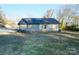 Back exterior of a one-story house with a grassy yard at 1014 Kansas St, Kannapolis, NC 28083
