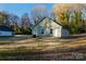 Rear exterior view of a single-story home with a lawn at 1014 Kansas St, Kannapolis, NC 28083