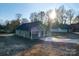 Green one-story home with a covered porch and driveway at 1014 Kansas St, Kannapolis, NC 28083